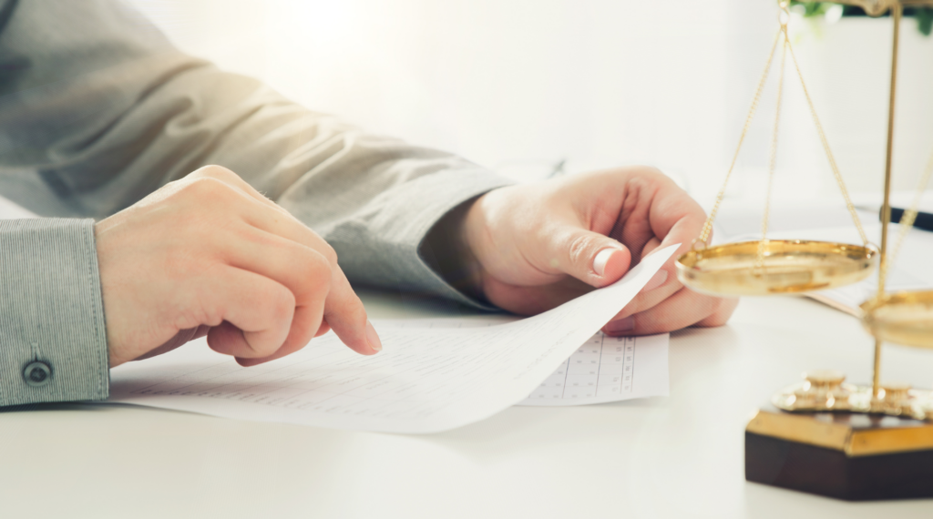 Man reads over legal glossary document